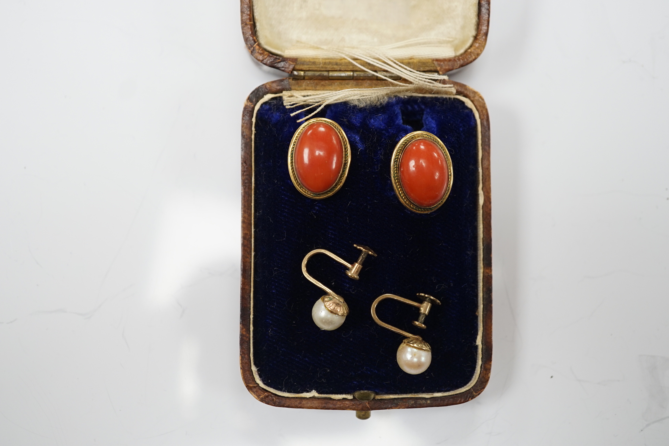 A pair of 750 yellow metal and cabochon coral set ear clips, 16mm and a pair of 9ct and single stone cultured pearl set ear clips.